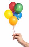 Hand holding colorful helium balloons isolated on white backgrou