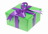 Green gift box with violet ribbon isolated on the white