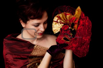 Portait of a woman, holding carnival mask