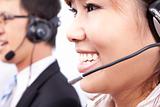 customer support team with  smiling businesswoman in an office