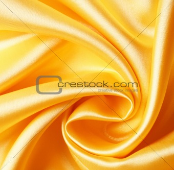 Smooth elegant golden satin as background 