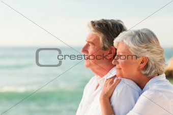 Woman hugging her husband at the beach