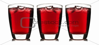 Three glass of red fruit juice with ice