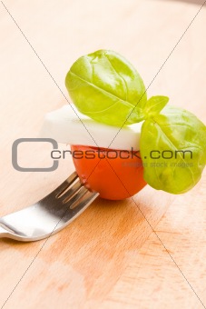 Fork with tomatoe and mozzarella