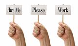 Three Signs In Male Fists Saying Hire Me, Please and Work Isolated on a White Background.