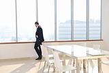 young business man alone in conference room
