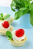 dessert tartlets with cream, mint and cherry