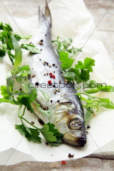 Fish herring on board with parsley and spices
