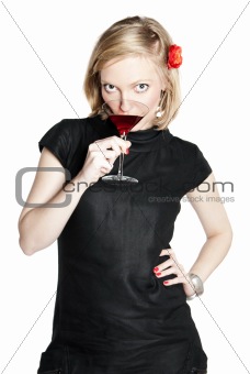 Young attractive woman holding a glass of red wine