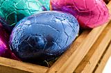 Colorful easter eggs in a wooden box