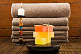 Soap candles and towels in a spa