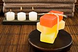 Soap candles and towels in a spa