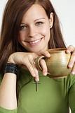 Young woman smiling with coffee