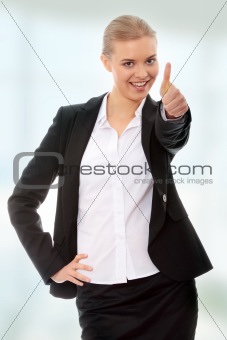 Young business woman showing OK sign