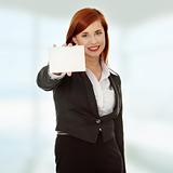 Business woman holding a blank card