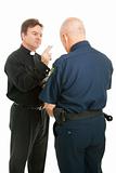 Priest Blesses Policeman