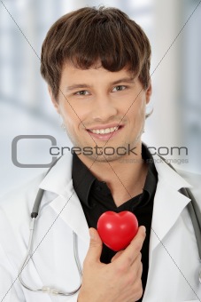 Doctor holding heart shape toy