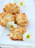 coconut cookies on a white napkin with flowers