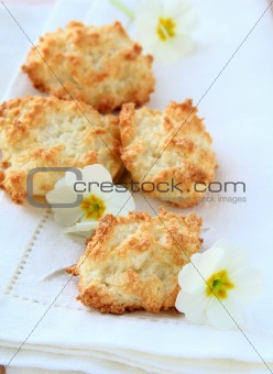 coconut cookies on a white napkin with flowers