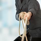 Businessman pulling on a rope
