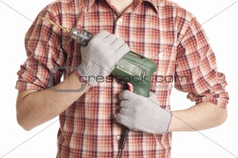 hands handling an electric drilling machine