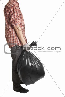 Man holding black plastic trash bag in his hand