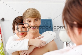 Young couple at bathroom.