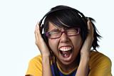 Asian teen lady screaming with headphones