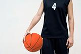 Asian teenage basketball player holding ball