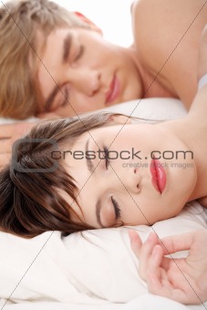 Young couple sleeping in bed. 