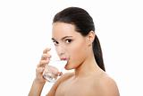 Beautiful young woman drinks clear mineral water