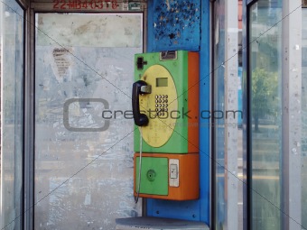 Old dilapidated public telephone Coin