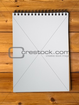 White sketch book on wood