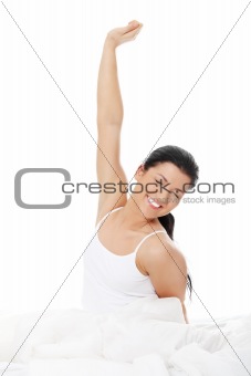 Happy young woman stretching