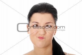 Young woman making squint