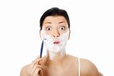 Young woman have morning shave
