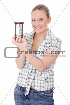 Young woman holding hourglass
