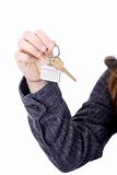 Young businesswoman with house keys in hand 
