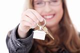 Young businesswoman with house keys in hand 