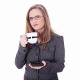 Businesswoman in a suit drinking coffee or tea.