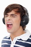 Young man's singing with headphones.