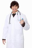 Handsome young doctor holding syringe.