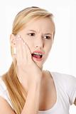 Young woman is having toothache