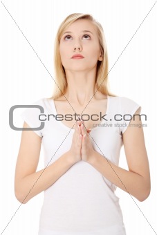 Young caucasian woman praying 