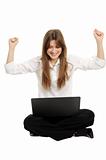 Woman with a laptop enjoying her online success