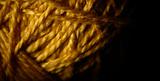 Macro shot of a ball of string texture isolated on black