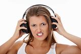 Emotional portrait of teen girl listening aggressive music