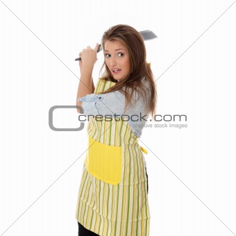 Angry young woman cooking
