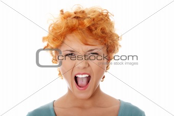 Furiouse young redhead woman screaming.