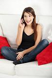 Beautiful young woman speaking by mobile phone